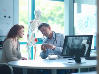 Doctor walking patient over the 3D Medical Printing model