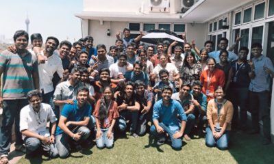 Group of people posing for picture