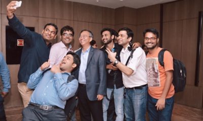 Chi Foon Chan with employees