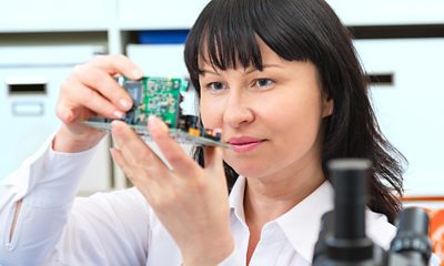 Women inspecting equipment