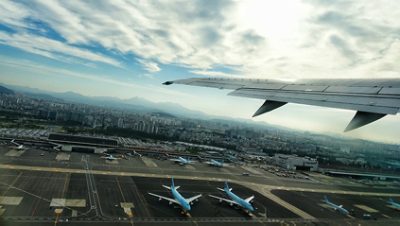 Commercial Airplanes Lined Up on Airport Runway Highlighting Software Security Vulnerabilities