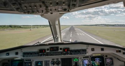 Airplane Instrument Panel Displaying Software and Sensor Systems on Runway