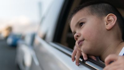 child looking out car window
