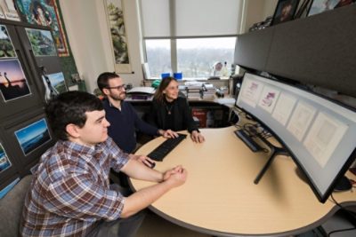 Dr. Aaron Bauer and graduate student Nick Tataki design a lens system in CODE V in collaboration with Professor Rolland.  