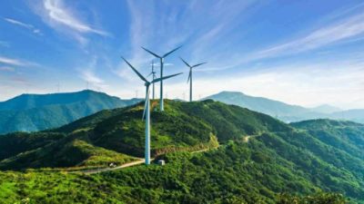 Wind turbines against blue sky