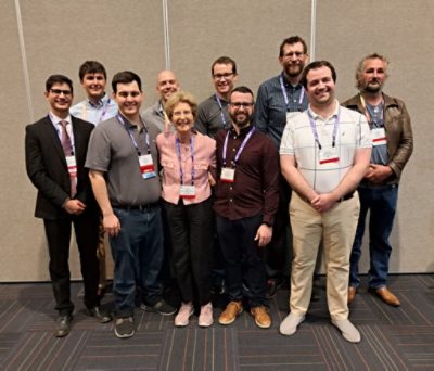 Tina Kidger with several current and past Michael Kidger Scholarship winners at IODC