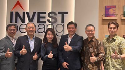 Group photo at PCDA opening with representatives from Oppstar, Synopsys, InvestPenang, Skeychip, and AMD.