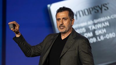 Synopsys CEO, Sassine Ghazi, shows the world’s first HBM4 IP test chip at Synopsys Converge on March 11, 2026, in Santa Clara, Calif.  