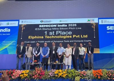 Elphins Technologies group onstage beneath the first-place Silicon Pitch Live announcement