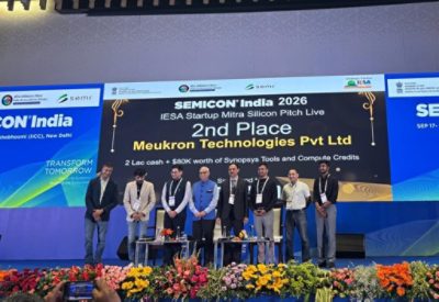 Meukron Technologies group onstage beneath the second-place Silicon Pitch Live announcement