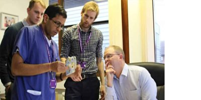 Surgeon discussing 3D printed anatomical model